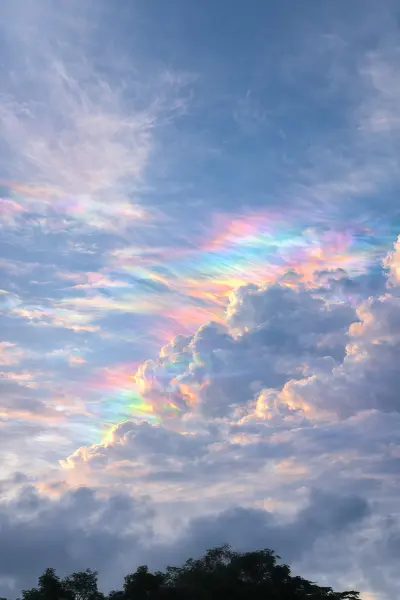 Stunning Iridescent Rainbow Clouds in Blue Sky